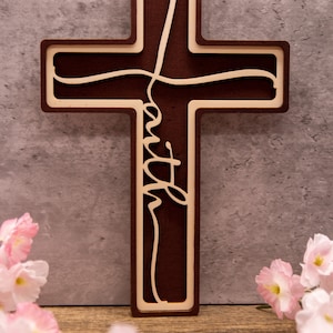 A cross with the word Faith