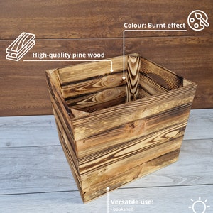 May include: A square wooden storage box with a burnt effect finish. The box is made of high-quality pine wood and measures 33 inches by 38 inches by 33 inches. It can be used as a bookshelf or for storing toys, tools, and accessories.