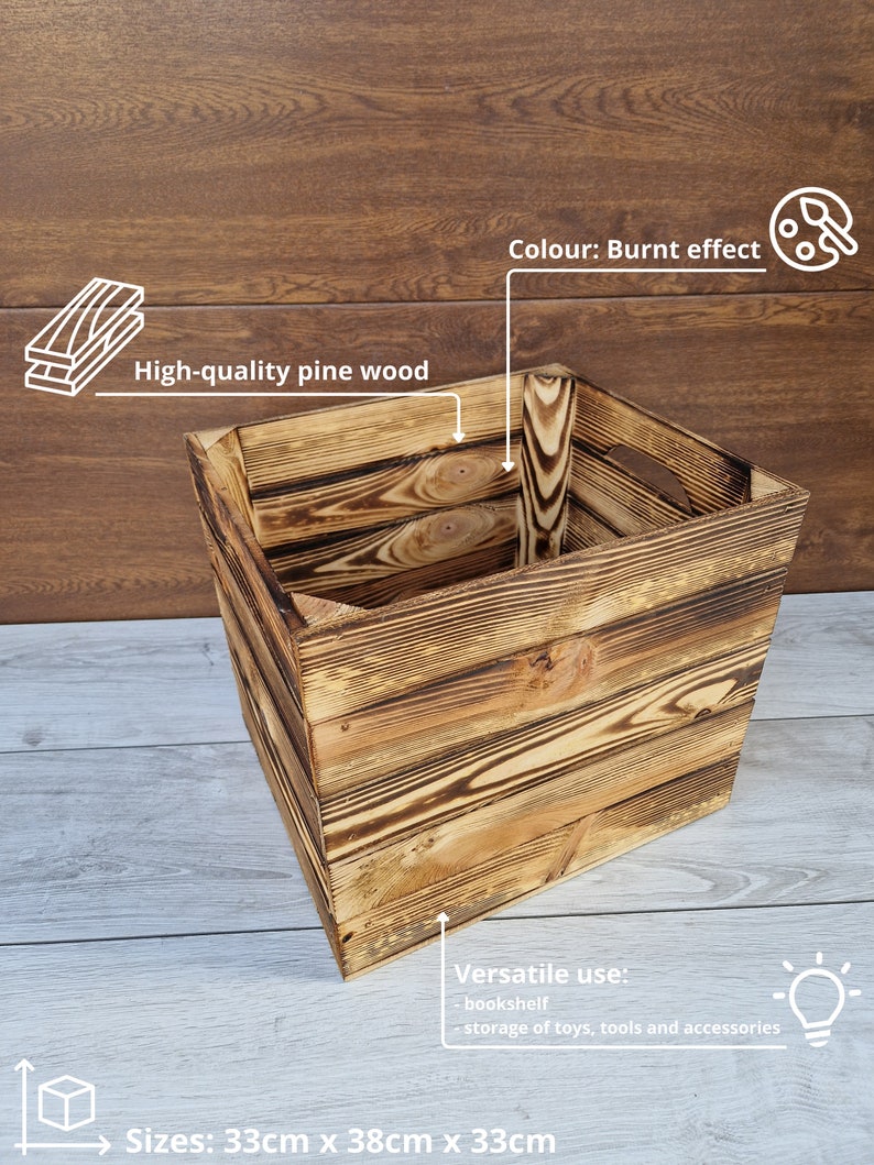 May include: A square wooden storage box with a burnt effect finish. The box is made of high-quality pine wood and measures 33 inches by 38 inches by 33 inches. It can be used as a bookshelf or for storing toys, tools, and accessories.