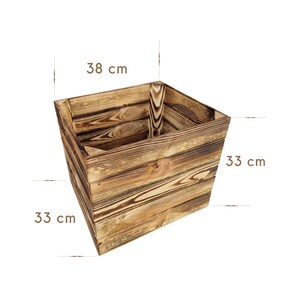 May include: A rustic wooden storage box with a natural wood finish. The box is 33 inches wide, 33 inches deep, and 38 inches tall.