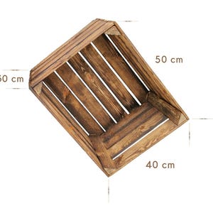 May include: A rustic wooden crate with a dark brown finish. The crate is 11.8 inches wide, 19.7 inches long, and 15.7 inches deep. The crate is made of wooden planks and is suitable for storage or display.