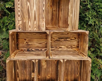 Cajas de almacenamiento de madera apilables para una organización sencilla del hogar. Madera quemada.