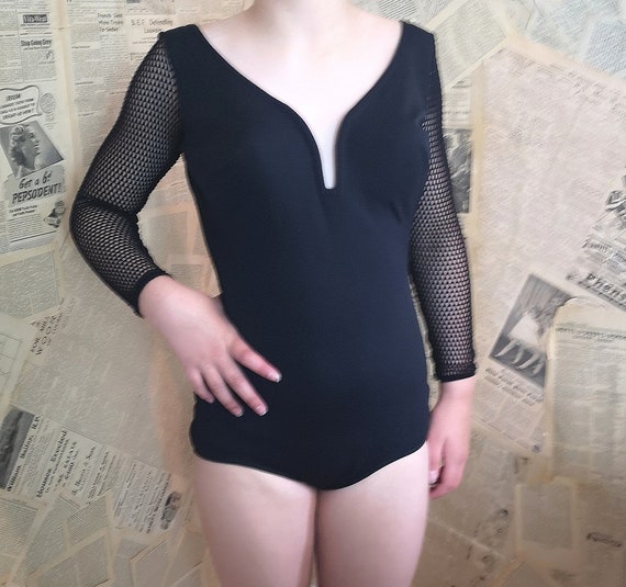 Vintage bombshell swimsuit, fishnet sleeves