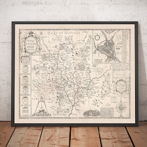 May include: A vintage black and white map of Staffordshire, England, with the text "PART OF STAFFORT SHIRE" at the top. The map shows the surrounding counties of Worcestershire, Shropshire, Herefordshire, and Gloucestershire. The map also includes a compass rose and a key to the symbols used on the map.