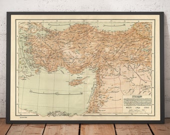 Pode incluir: Um mapa vintage do Império Otomano, impresso em árabe, com características geográficas detalhadas e nomes de lugares. O mapa é emoldurado em preto e tem um fundo marrom claro.
