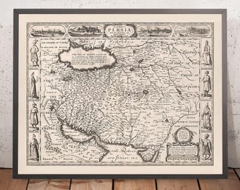 May include: A vintage black and white map of Persia, showing the borders of the Turkish Empire, the Sea of Baku, and the borders of Tartary. The map is framed in a black frame and has a cream background.