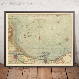 May include: A framed vintage map titled "PLAN OF THE ROAD AND CITY OF BATAVIA ON THE NORTH COAST OF JAVA ISLAND." The map depicts the coastline, sea, and city with detailed illustrations, compass roses, and nautical lines. The color scheme includes blue, beige, and brown hues.