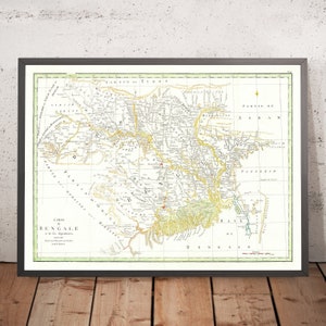 May include: An antique map of Bengal, India, from the 18th century. The map is printed in black and white with hand-colored details. The map shows the rivers, cities, and towns of Bengal. The title of the map is "Carte du Bengale" and the text is in French.