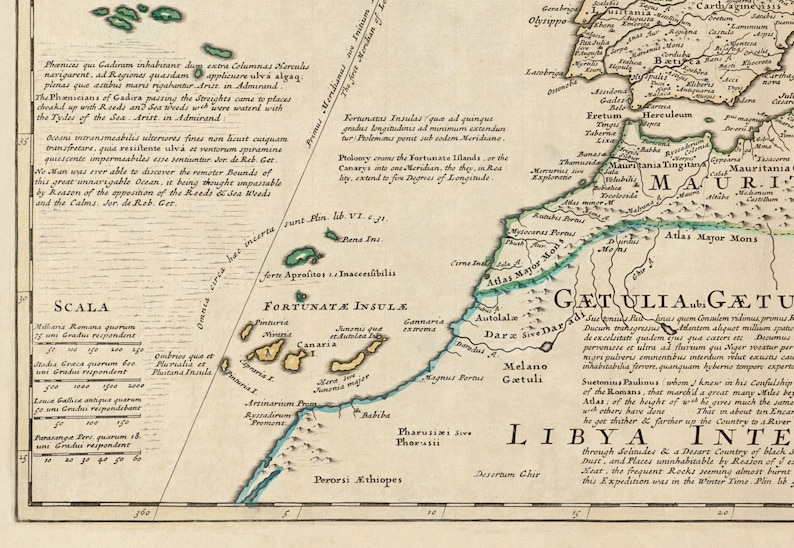 May include: An antique map of North Africa, showing the coastline of the Mediterranean Sea and the Atlas Mountains. The map is in shades of green, blue, and brown, with text in black and red. The map is titled "Getulia ubi G&aelig;tuli habitant" and includes the text "Fortunate Insul&aelig;" and "Libya Interior".