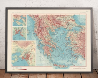 May include: A vintage map of Greece with detailed topography and coastline. The map is printed on cream-colored paper and framed in a dark gray frame. The map title is "MODERN GREECE" and the map is part of the "PERGAMON WORLD ATLAS" series.