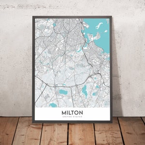 May include: A black and white map of Milton, Massachusetts, with blue water features. The map is framed in a black frame and has the text "Milton, United States" at the bottom.