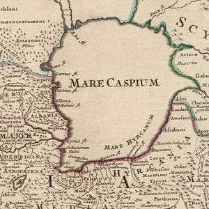 May include: An antique map of the Caspian Sea and surrounding regions, with detailed geographical features and names of ancient civilizations, including the Scythians, Albanians, and Armenians. The map is printed in black and brown ink on a cream-colored background.