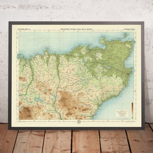 May include: A vintage map of Scotland, printed in green and brown tones, with the title "Bartholomew's "Half-Inch to Mile" Map of Scotland." The map is framed in a black frame.