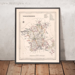 May include: An antique map of Worcestershire, England, with a detailed outline of the county's borders and towns. The map is printed in black, red, green, and yellow ink on a white background. The title "WORCESTERSHIRE" is printed in black at the top of the map.