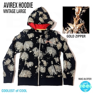 May include: Black zip-up hoodie with a floral pattern in gold. The hoodie has a red interior lining and a gold zipper. The text "AVIREX HOODIE VINTAGE LARGE" is at the top. The text "GOLD ZIPPER" is also visible.