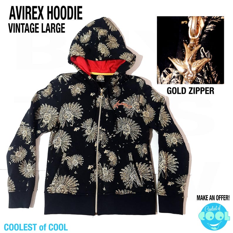 May include: Black zip-up hoodie with a floral pattern in gold. The hoodie has a red interior lining and a gold zipper. The text "AVIREX HOODIE VINTAGE LARGE" is at the top. The text "GOLD ZIPPER" is also visible.