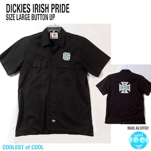 May include: Black button-up shirt with short sleeves. The shirt features the text "DICKIES IRISH PRIDE SIZE LARGE BUTTON UP" at the top. The front and back of the shirt have a green and white logo. The text "COOLEST OF COOL" is at the bottom.