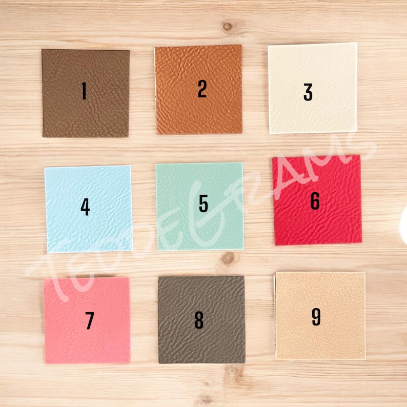 May include: Nine different color and texture swatches of leather. The swatches are numbered 1 through 9.