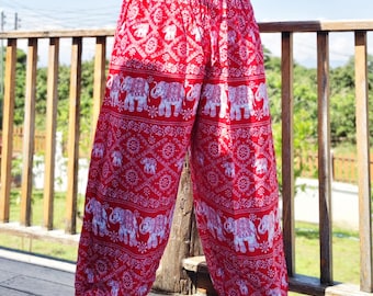 May include: Red and white patterned pants with an elephant design. The pants have a drawstring waist and a loose, comfortable fit. The fabric appears to be lightweight, suitable for warm weather.