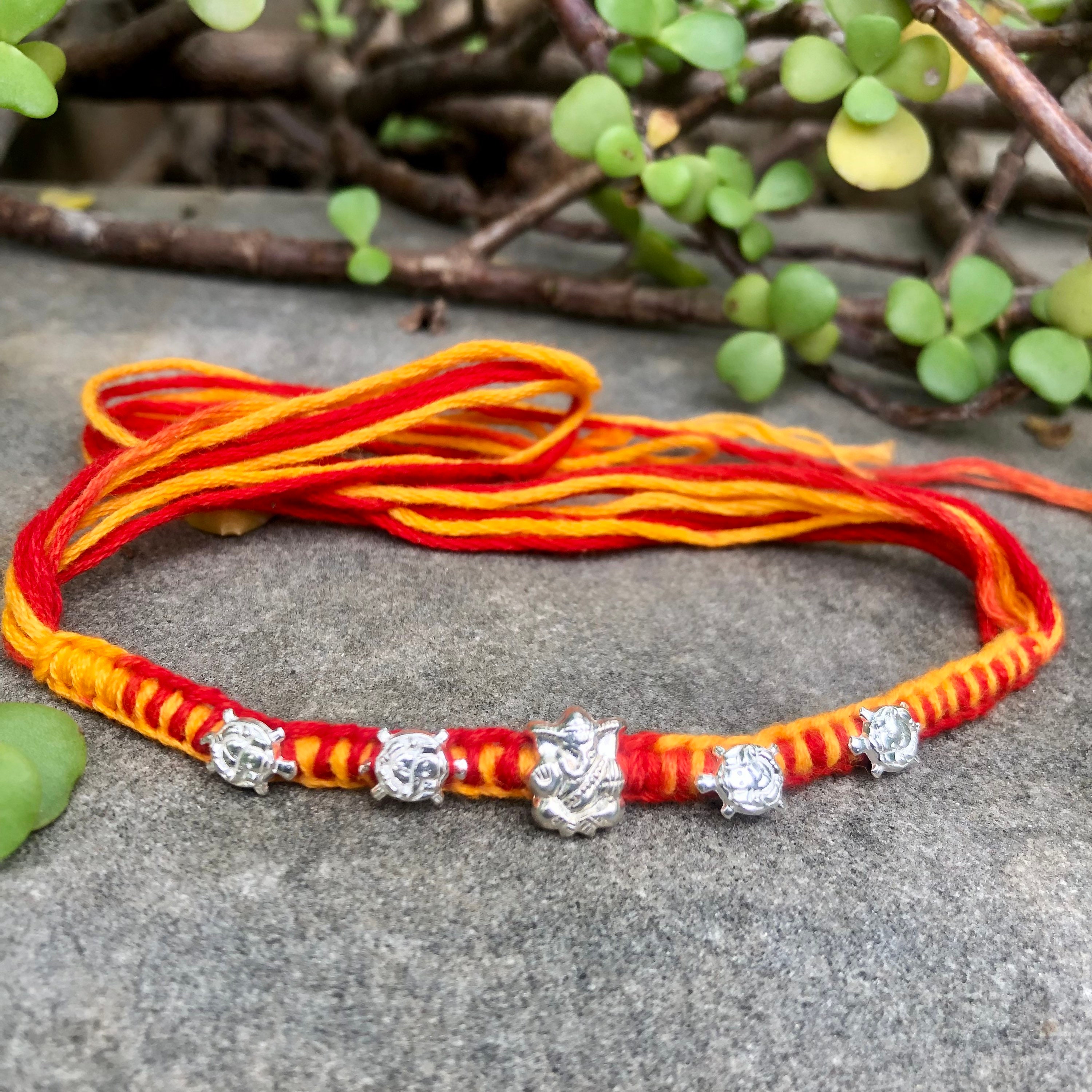 Rakhis Online UK-5595 Rudraksh pearl bracelet rakhi – Ghasitaram Gifts