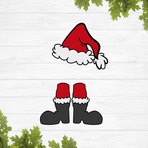 May include: A cartoon illustration of a red Santa hat with white trim and a pair of black boots with red tops and white trim. The image is set against a white wood-grain background, evoking a festive holiday theme.