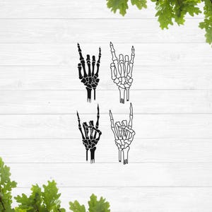 May include: Four black and white skeleton hand illustrations with the index and pinky fingers extended, forming a rock and roll hand gesture.