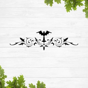 May include: Black silhouette of a bat with wings spread, centered above a decorative flourish design. The design features a series of swirls and curves, creating a symmetrical pattern.