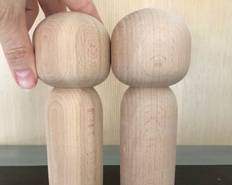 unfinished kokeshi dolls
