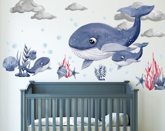 May include: A nursery wall decal set featuring a blue whale with a smaller whale swimming beside it. The set also includes coral, seaweed, and bubbles. The decals are perfect for adding a whimsical touch to a child's room.