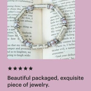 May include: A delicate bracelet made from pages of a book, with pink and white beads. The bracelet is lying on a book with the text "Yes, vanity superiority of mind, pride Elizabeth turned away Your examination of ley;-'and pray wh perfectly convin mself without id Darcy, 'I they are 1 for.-1 nvenien OWL e a charming No enough dare not little for t vices of oth My feeling My temy once lo T Bennet's SO SOOT not p Suld pe ust for ev a failing shade in a Yeally cannot lau There is, I believ ticular evil, a natur overcome." 'And your defect Lours' he"