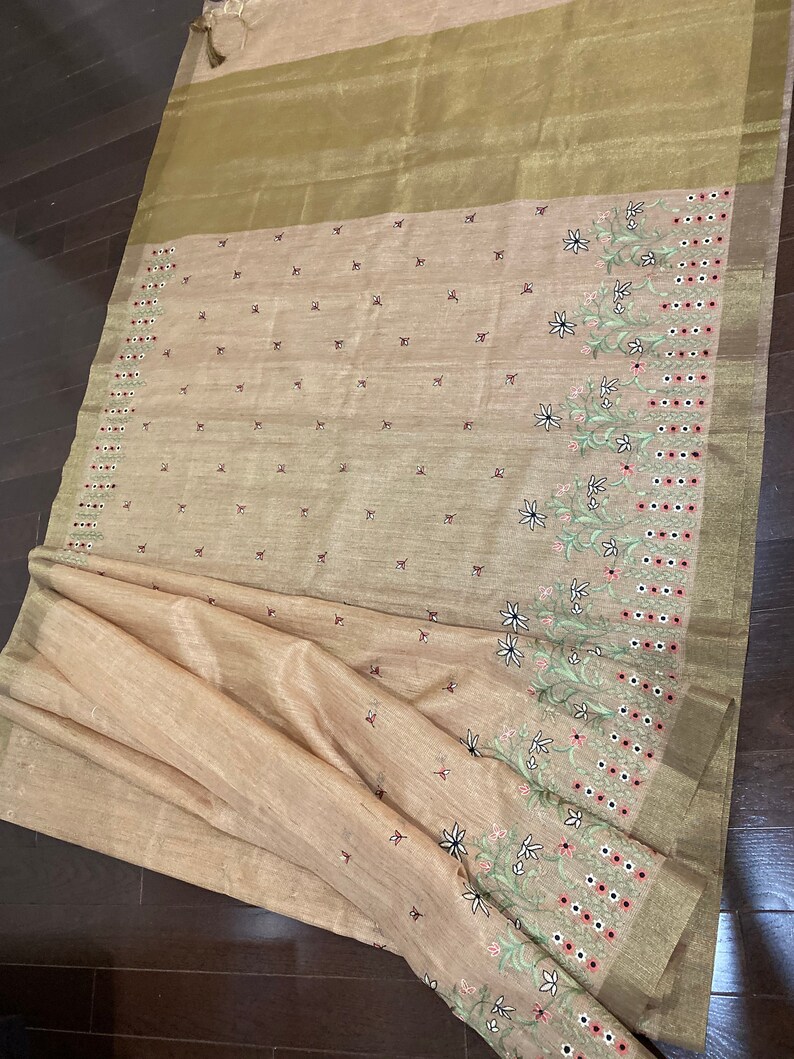 Peachy Jute embroidery saree paired with trendy blouse
