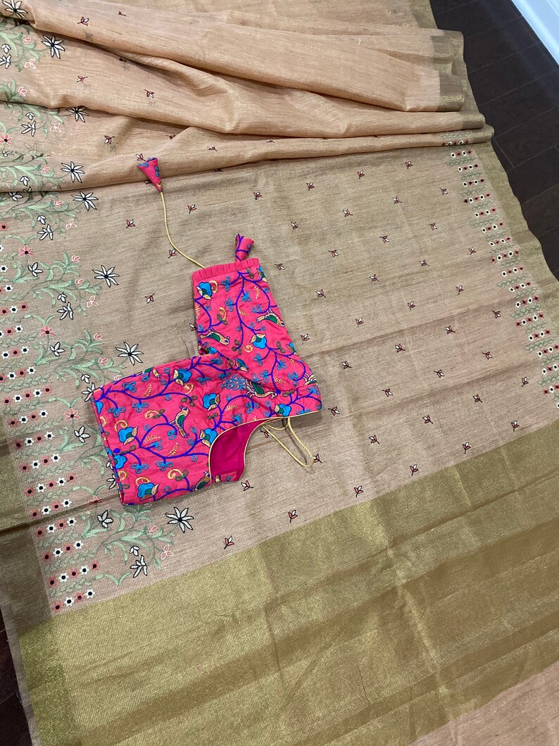 Peachy Jute embroidery saree paired with trendy blouse