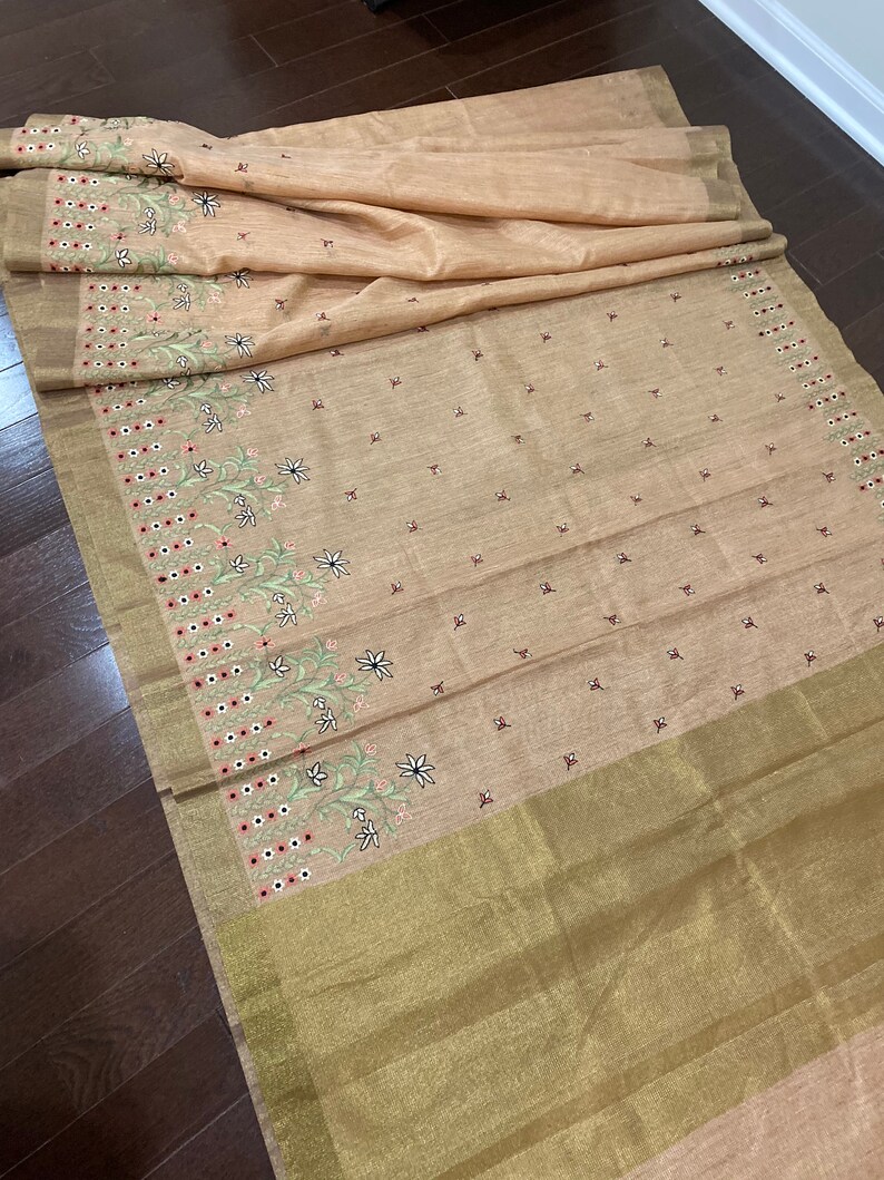 Peachy Jute embroidery saree paired with trendy blouse