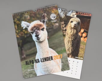 May include: A 2027 wall calendar featuring alpaca photography. The cover displays a white alpaca with brown markings, the text ALPA-KA-LENDER 2027, and the phrase 12 Monate: Unsere Alpaka-Bande aus Unterfranken 100% wir. A second page shows a shaggy alpaca.