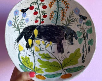 Stoneware Salad Bowl “Black and White Dog in the Garden” – Hand-shaped and hand-painted, blue illustrated exterior with birds, snake, and ra