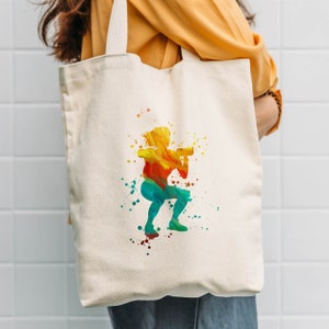 May include: A white canvas tote bag with a colorful watercolor silhouette of a person lifting weights. The silhouette is in shades of yellow, orange, red, green, and blue.