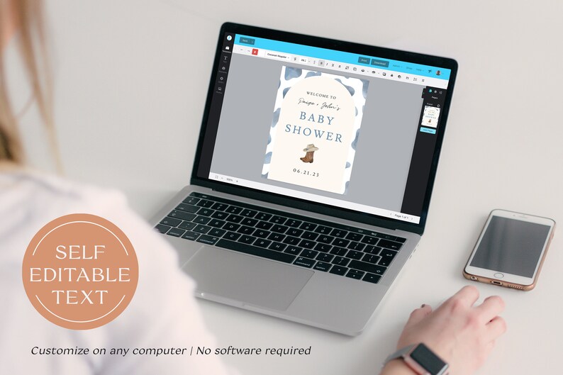 May include: A laptop displays a baby shower invitation with a cowboy theme. The invitation features a blue and white cow print design, a cowboy boot illustration, and the text "Welcome to [Names] Baby Shower 04.21.23". A smartphone sits to the right.