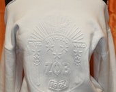 White on White Embossed Shield Cold Shoulder Top