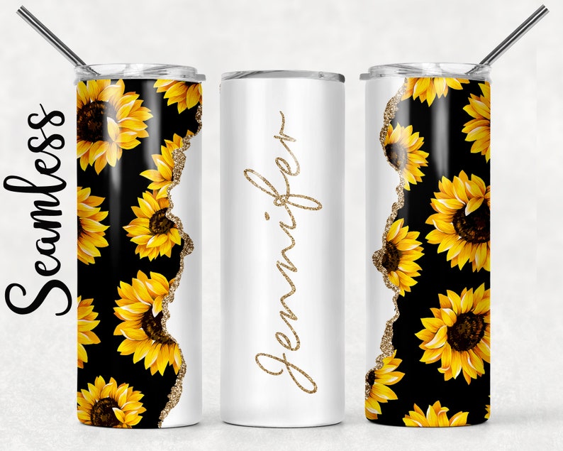 May include: Three stainless steel tumblers with a gold glitter edge. The tumbler on the left and right have a black background with a repeating pattern of yellow sunflowers. The tumbler in the middle is white with the name "Jennifer" written in gold glitter.