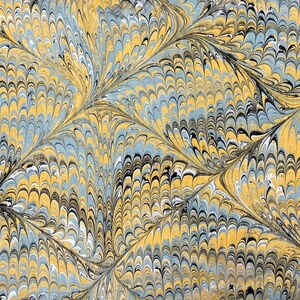 May include: Abstract marbled paper with a swirling pattern of yellow, blue, black, and white. The pattern resembles feathers or scales.