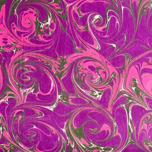 May include: Abstract marbled paper with swirling patterns in shades of pink, purple, and black.