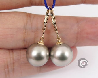May include: A pair of gold hoop earrings with large gray pearl drops. The earrings are hanging from a blue cord.