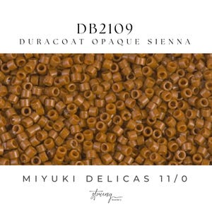 May include: Close-up of a pile of small, cylindrical, opaque Sienna-colored beads. The beads are labeled "DB2109" and "DURACOAT OPAQUE SIENNA". The text "MIYUKI DELICAS 11/0" is also visible. The beads are from the "string beadery" brand.