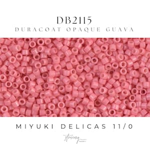 May include: Close-up of a pile of small, cylindrical, pink beads. The beads are labeled "DB2115 DURACAT OPAQUE GUAVA" and "MIYUKI DELICAS 11/0". The beads have a matte finish and are tightly packed together. The word "string" is also visible.