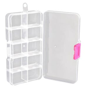 May include: A clear plastic storage organiser box with ten individual compartments. The rectangular container features a hinged lid and a bright pink latch on the side for secure closure. A small hanging loop is located at the top of the unit.
