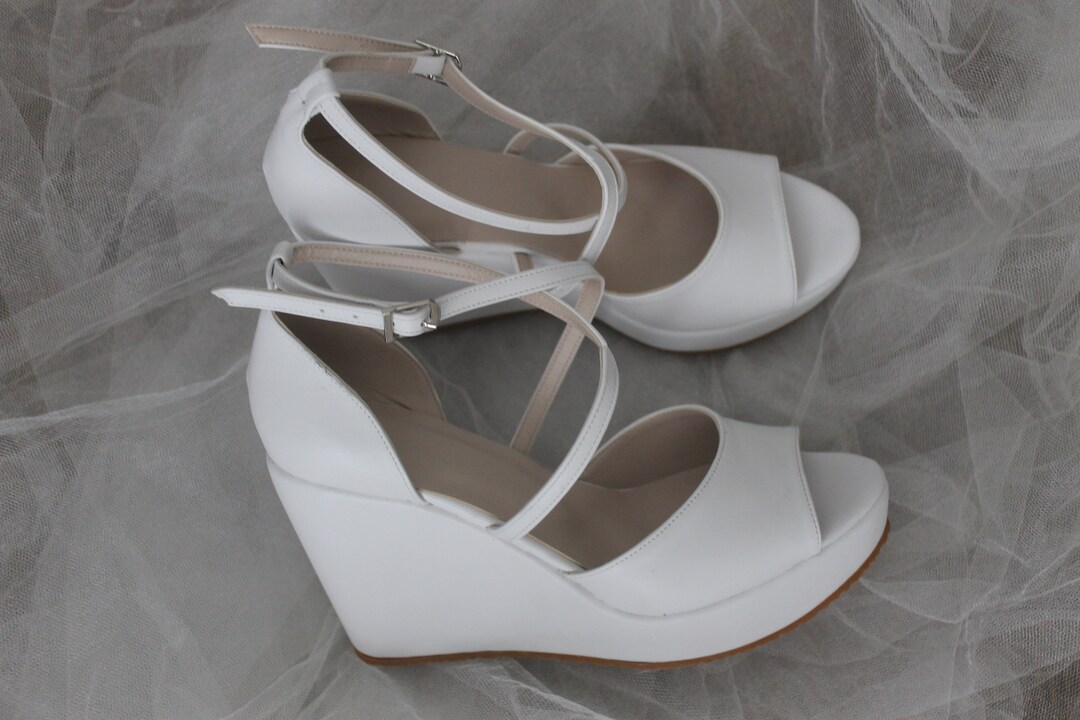 criss cross wedge sneakers