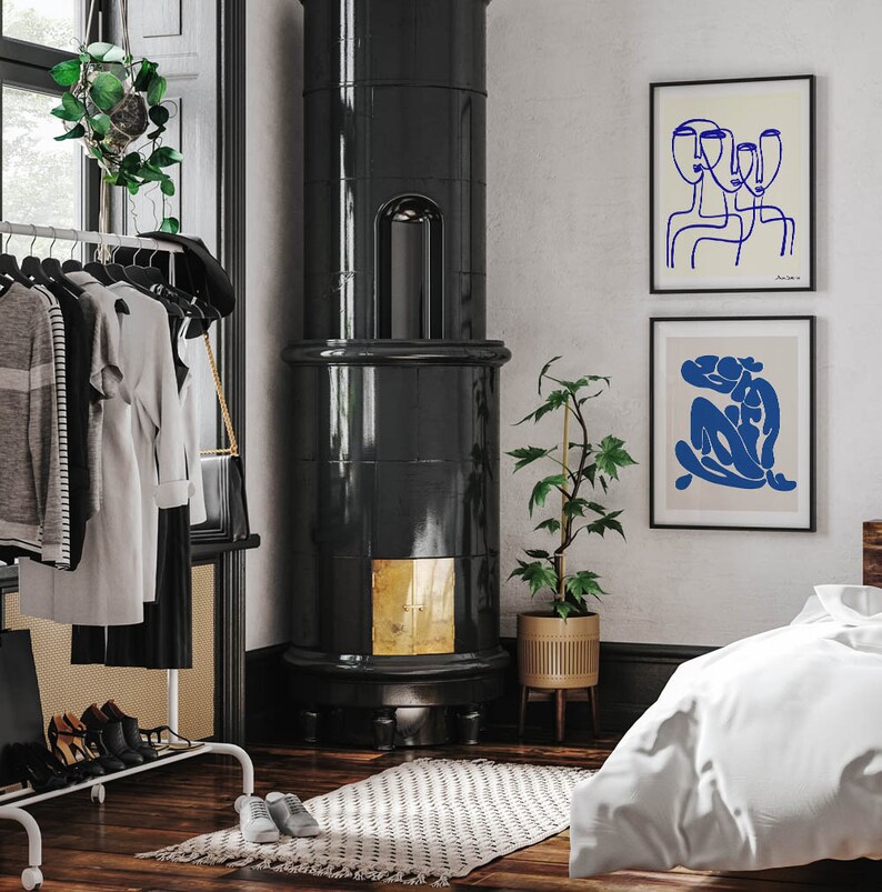 a bedroom with a bed, a chair, and a fireplace