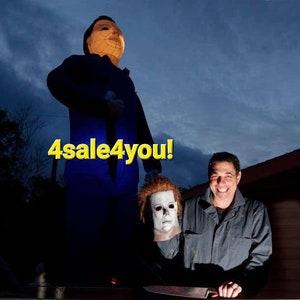 May include: A man stands next to two large Michael Myers masks, one of which is holding a knife. The text "4sale4you!" is superimposed on the image.