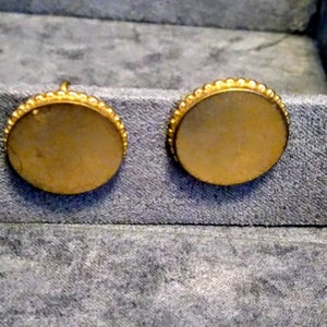 Vintage Gold Tone circle screw back earrings marked Coro (scripted)