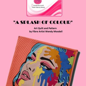 May include: A colorful art quilt featuring a woman's face with paint splatters. The quilt is titled "A Splash of Colour" and is by Fibre Artist Wendy Mosdell.